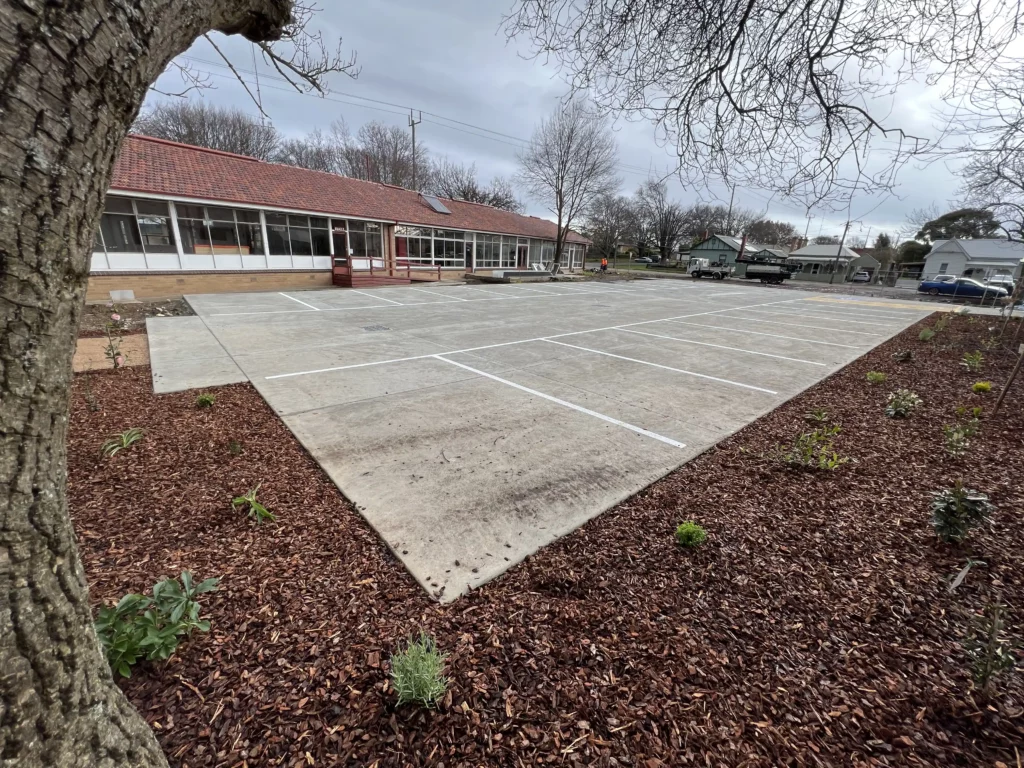 Newly installed garden beds with trees and shrubs beside the car park in Ballarat.