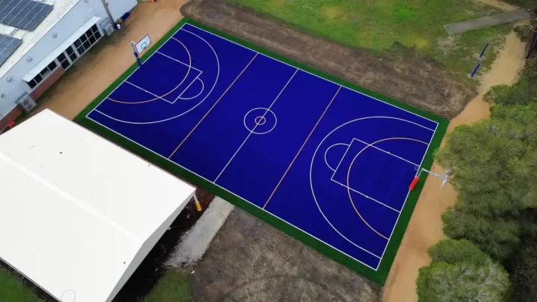 Overhead image of a sports court with custom game lines and synthetic grass.